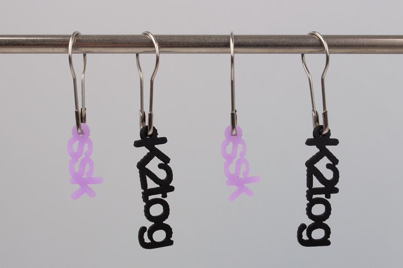 Lazadas: Maschenmarkierer (k2tog-ssk schwarz.lila)